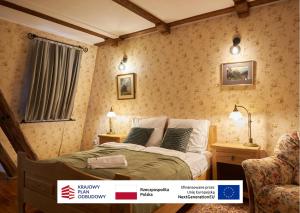 a bedroom with a bed and two chairs at Vincent OldTown Apartments in Wrocław