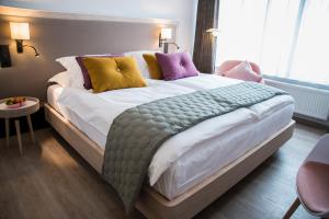 Postel nebo postele na pokoji v ubytování ABC Hotel