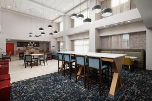 a large room with a table and chairs at Hampton Inn & Suites McAllen in McAllen