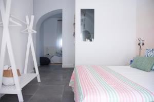 Postel nebo postele na pokoji v ubytování Hostal La Casa Sanlúcar