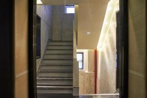 a hallway with stairs in a building at M Plus Hotel in Hong Kong