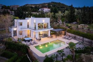 an aerial view of a house with a swimming pool at Vista by Del Sol Villa in Rhodes Town