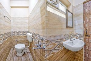 a bathroom with a toilet and a sink and a mirror at Via KR in Chennai +25 photos