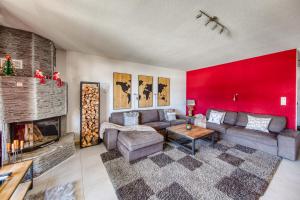 a living room with a couch and a fireplace at Ski-in Ski-out with Chimney and view in Les Crosets +18 photos