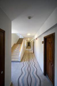 a long hallway with stairs and a stair case at La Vida Suite in Beirut