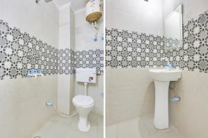 a bathroom with a toilet and a sink at Hotel O Dwarka Metro in New Delhi +39 photos