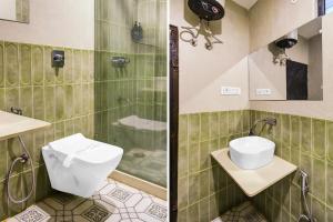 a bathroom with a toilet and a shower at Townhouse Chandpole Metro Station Formerly Hotel Raghuraj Palace in Jaipur