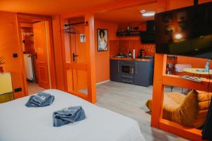 a room with two bunk beds and a kitchen at sleepArt music in Celle +11 photos