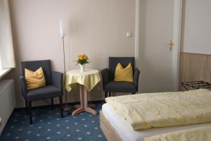Ein Bett oder Betten in einem Zimmer der Unterkunft Mein Vierjahreszeiten Hotel Garni Superior