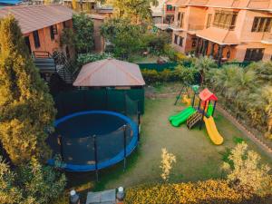 an aerial view of a backyard with a playground at Hotel Yechu Comfort Heritage in Bhaktapur