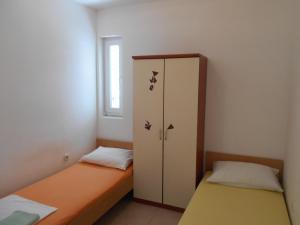 Postel nebo postele na pokoji v ubytování Apartments Dunja Hvar