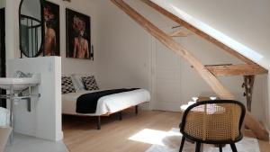 a bedroom with a bed and a sink in a room at La Charmeraie d'Aumâtre in Aumâtre +85 photos