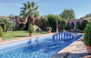 a swimming pool with a bridge in a yard at Villa Rocio in Setenil