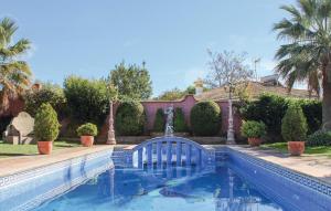a swimming pool in a yard with a fountain at Villa Rocio in Setenil +20 photos