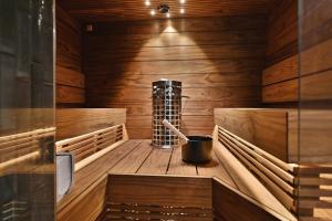 a sauna with a mortar and pestle in it at Villa Taruilevi 3 inc Hot Tub in Levi +31 photos