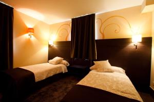 Cama o camas de una habitación en Hotel Restaurante Puente Romano