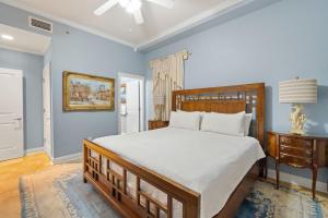 a bedroom with a large bed and a table at La Playa 1001 in Perdido Key