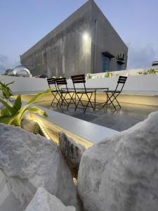 a group of chairs sitting on top of a building at NEMO house in Cu Lao Thu
