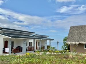 a house with a view of the ocean at Salamya Guesthouse in San Juan