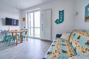 a living room with a couch and a table at Infinity Blue in Portovenere