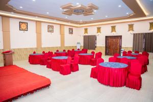 a conference room with red chairs and tables in it at Hotel Yechu Comfort Heritage in Bhaktapur +106 photos