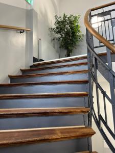 a set of stairs in a building at DH Hotel Deutsches Haus Mittweida - Ihr digitales Hotel in Mittweida