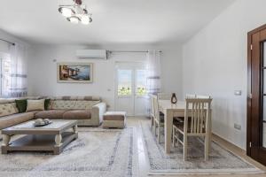 a living room with a couch and a table at Castle Serenity Home 3BR with Free Parking by PikHost in Gjirokastër