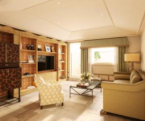 a living room with a couch a chair and a table at Grand Hotel Timeo, A Belmond Hotel, Taormina in Taormina