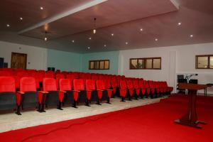 a room with red chairs and a table and a red carpet at The Africana Hotel in Isiolo +106 photos