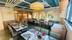 an overhead view of a restaurant with tables and chairs at Elegance Inn in Varanasi