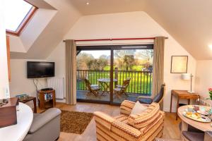 a living room with a couch and chairs at Finest Retreats - Canal Central in Ball +13 photos