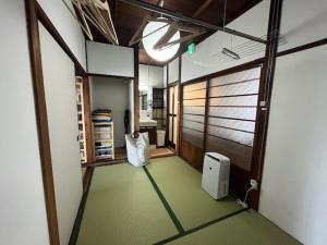 an empty room with a room with a door and a room with a room at 民泊 Knock Knock in Habikino