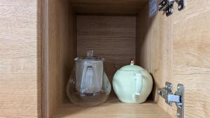a glass jar and a vase in a wooden box at 民泊 Knock Knock in Habikino +26 photos