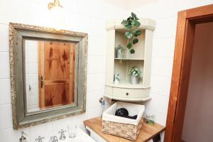 a bathroom with a mirror and a sink at Guest House Dell'Affresco in Reggio Emilia +33 photos