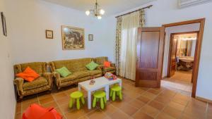 a living room with a couch and a table at El Olmo Posadas by Ruralidays in Posadas