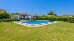 a swimming pool in the yard of a house at El Olmo Posadas by Ruralidays in Posadas