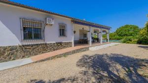 a house with a porch and a patio at El Olmo Posadas by Ruralidays in Posadas