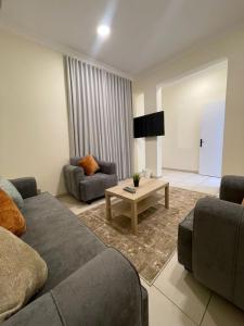 a living room with a couch and a table at وحدات سكنية مفروشة in Jeddah