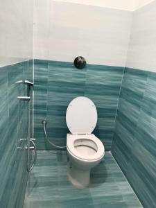 a bathroom with a toilet and a shower at Pushpanjli grand inn in Ayodhya +9 photos