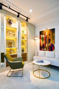 a living room with a couch and a coffee table at İSTPORT GARDEN HOTELS in Arnavutköy