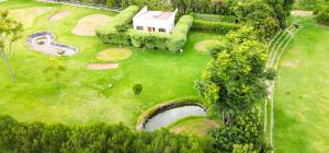 an overhead view of a house on a green field at Ngao #220 Swara Ranch in Nanyuki