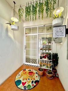 a room with a table in front of a window at อมรรัตน์Room in Pathum Thani