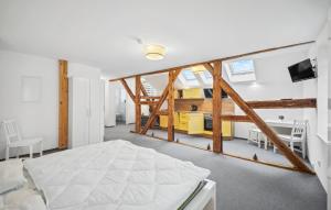 a bedroom with a bed and a loft at Gut Barzig in Großräschen