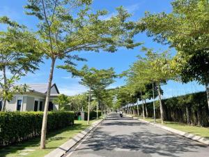 a street with trees on the sides of a road at Villa Coastar 002 Hồ Tràm in Ho Tram