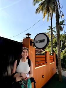 a woman is standing in front of a train at Social Stays in Negombo +26 photos