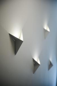 three black origami birds hanging on a wall at KALLINO Island Suites in Ermoupoli +92 photos