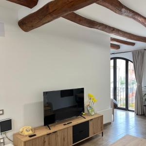 a living room with a large flat screen tv at La Casa Vella in Navarcles