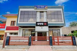 a building with a sign on the front of it at Hotel O DREAM INN in Alwar +21 photos