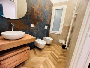 a bathroom with a sink and a mirror at Suite Borgo 112 - Sanremo in Sanremo
