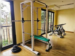 a gym with two treadmills and two bikes at Paseo Verde Condo Unit in Las Pinas - Sleeps 2 Adults & 2 Children in Manila